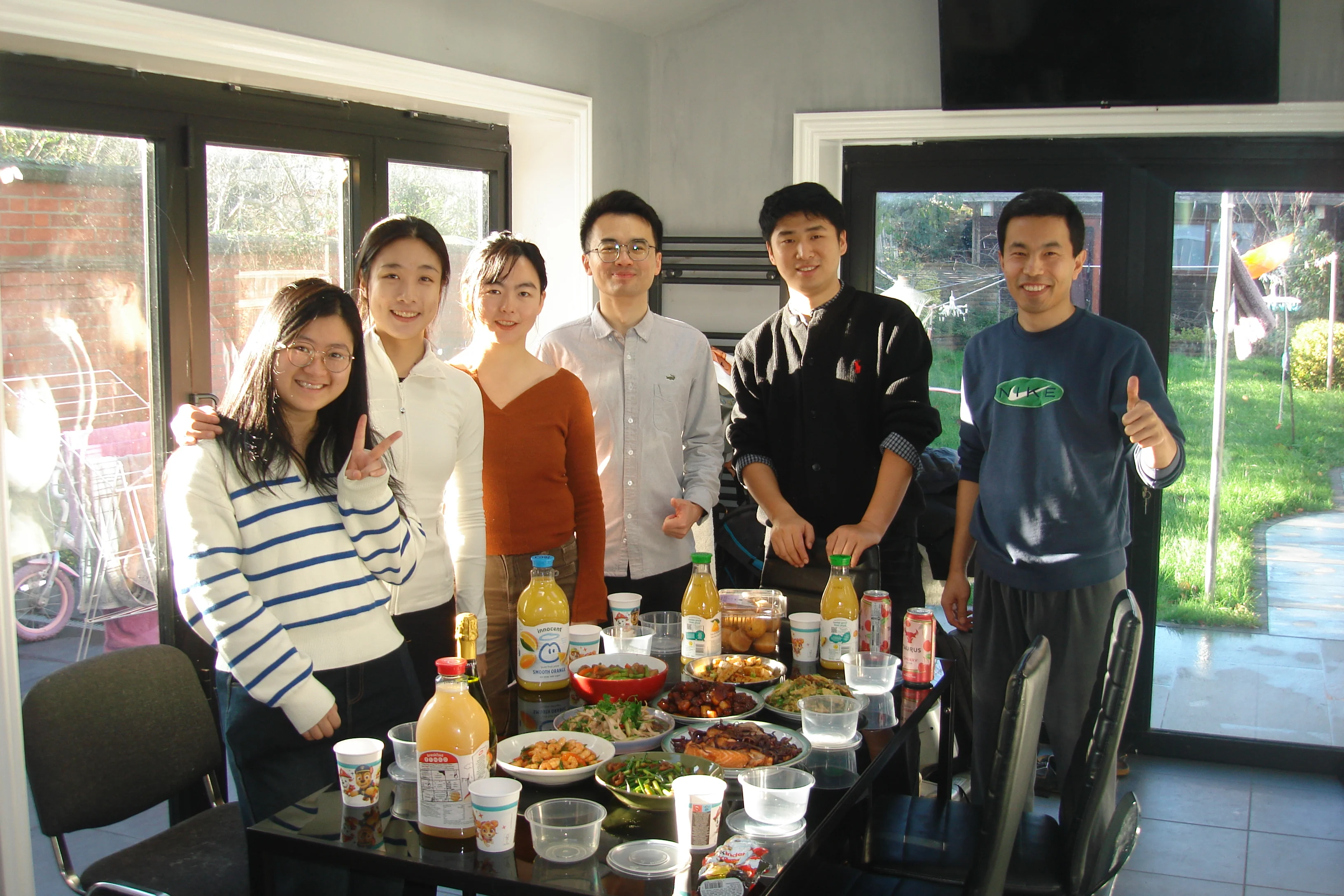 A gathering around the dining table at the homestay