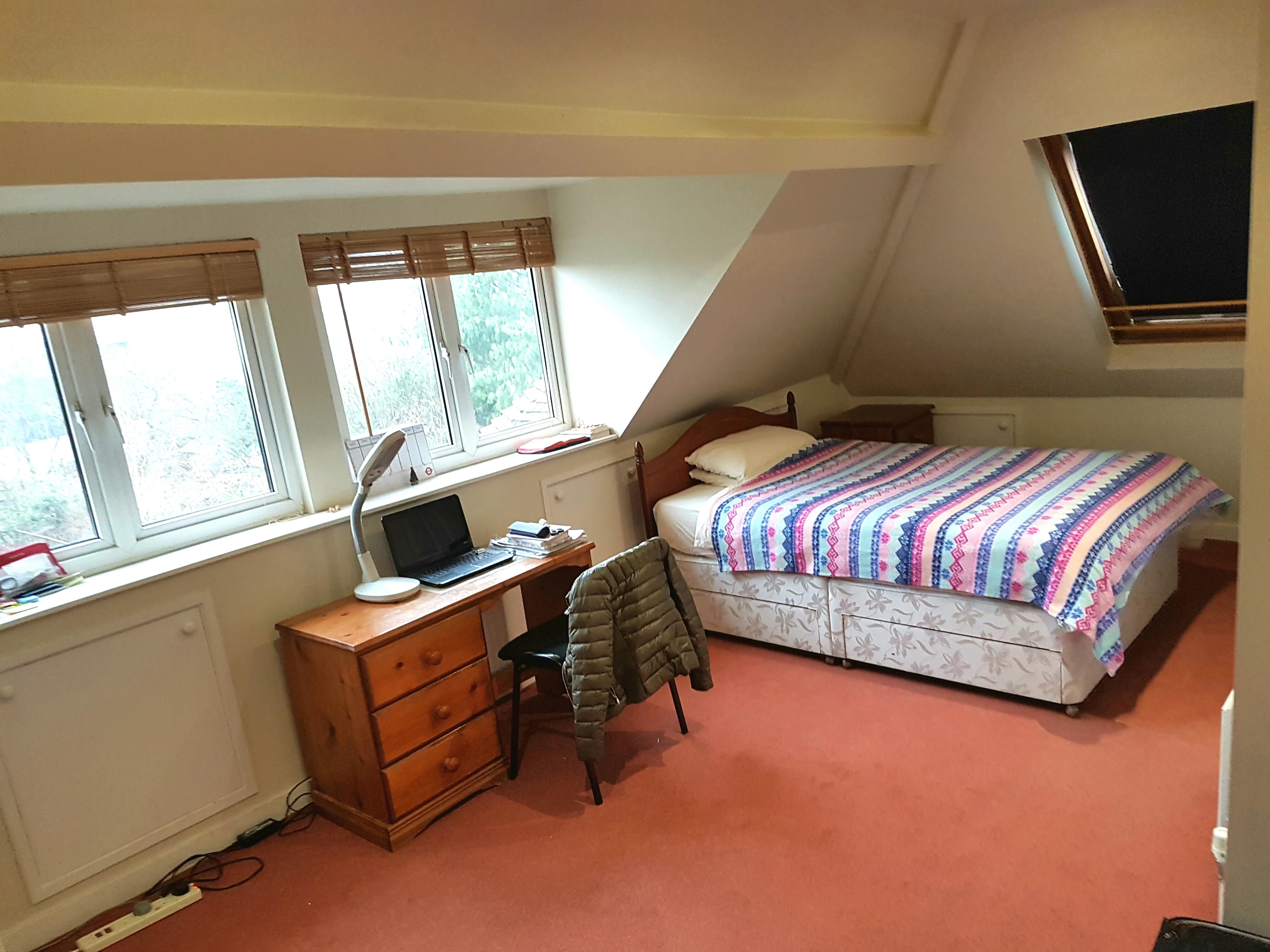 Room 5: a double bed and desk in the loft